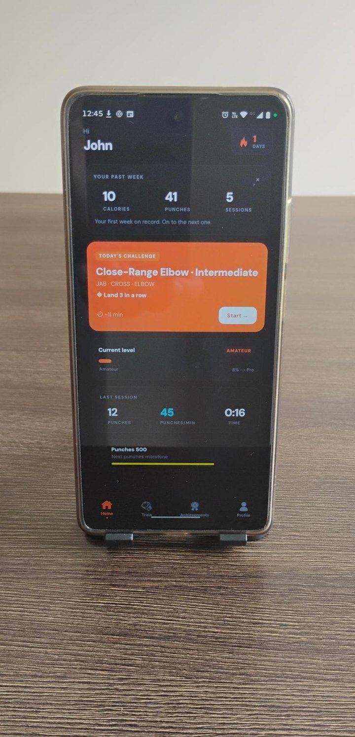 Phone standing upright on a table, screen facing you
